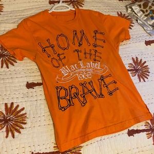 Black Label | Orange Home of the Brave Shirt